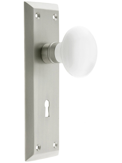 Classic New York Style Mortise Lock Set in Satin Nickel with White Porcelain Door Knobs.